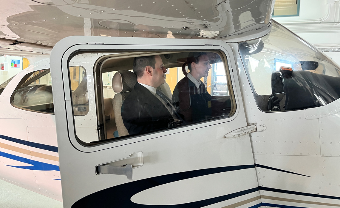 Demitrios Nicolaides sits with Ashleigh Morrow in a Cessna 172 at MRU's springbank airport campus.