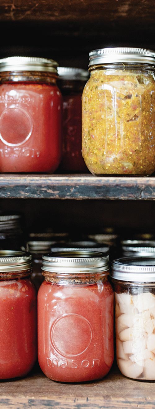 Closeup photo of jars of preserved food on shelves