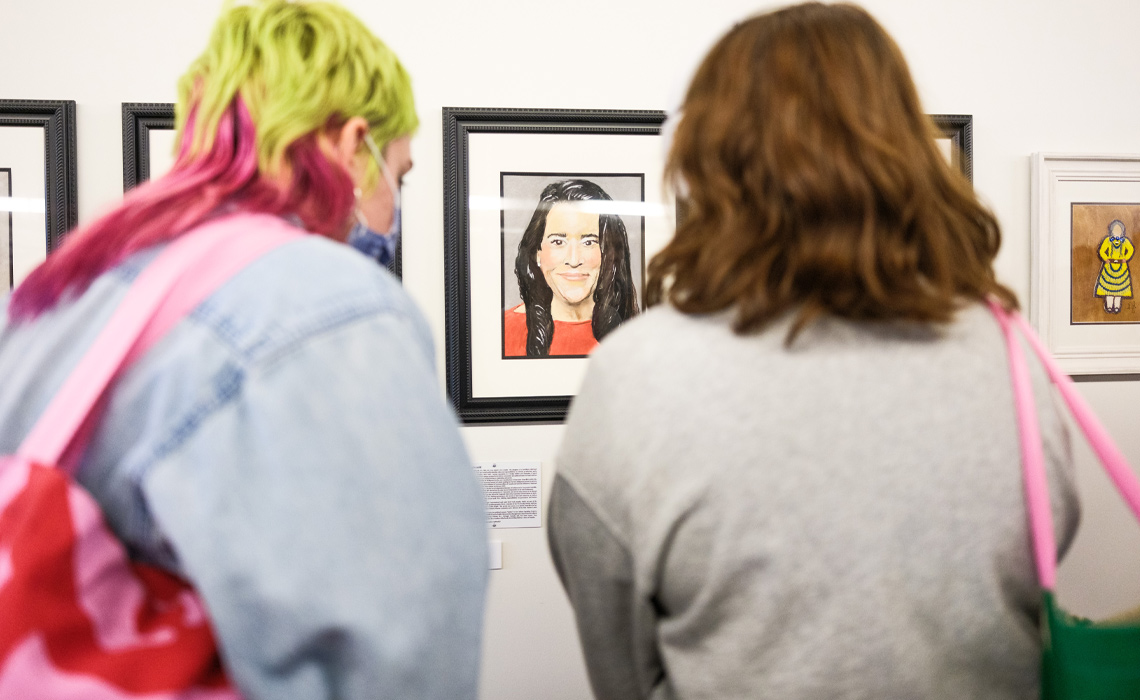 Visitors take in the Aunties/Anti Art Exhibition on March 7.