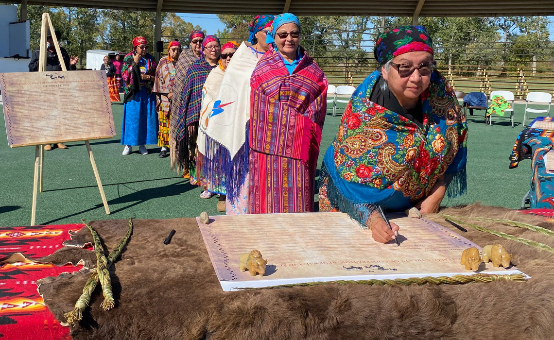 Members of Mao’to’kii (Buffalo Women’s Society) re-sign the Treaty on Sept. 25 at Red Crow Park in Stand Off.