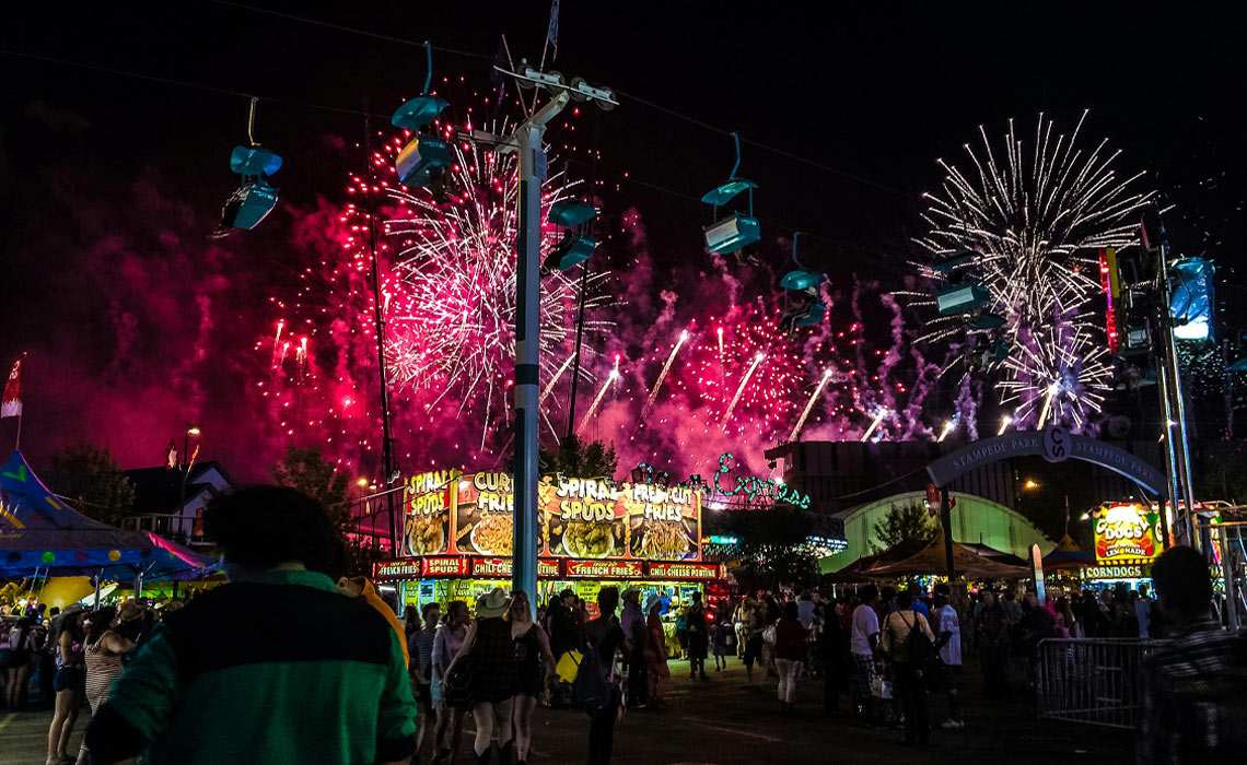 Fireworks illuminate the night sky above the Calgary Stampede.