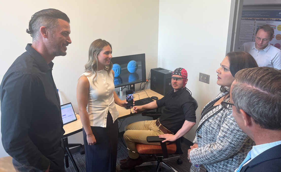 From left to right: Psychology professor Dr. Dan Devoe, PhD, Kaitlin Berlinguette, current student, the Honourable Rajan Sawhney, Minister of Advanced Education, Connor Campbell, alumnus, Dr. Chad London, PhD, acting president and vice-chancellor.