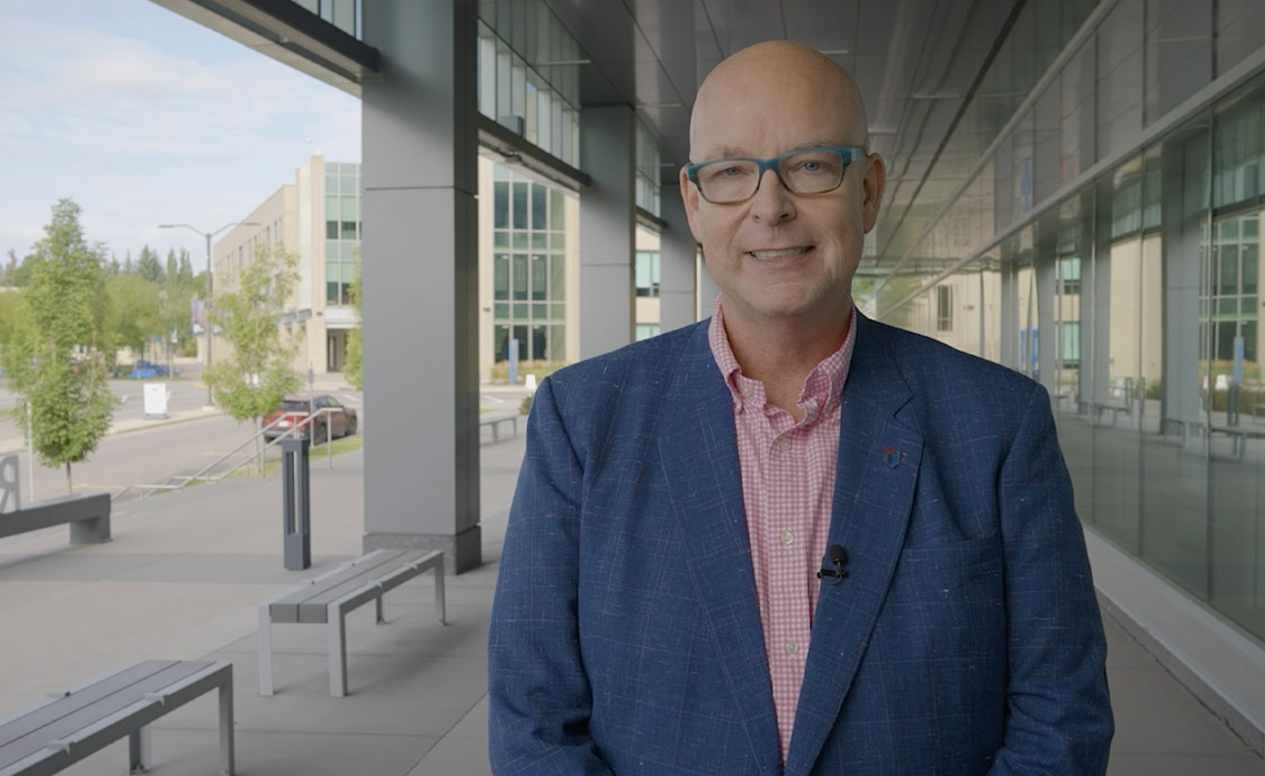 Tim Rahilly, PhD, poses for a photo outside of the Riddell Library & Learning Centre.