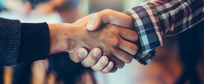 Photo of professionals shaking hands