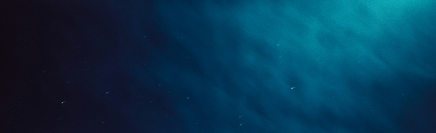 A cloudly, blue nighttime sky.