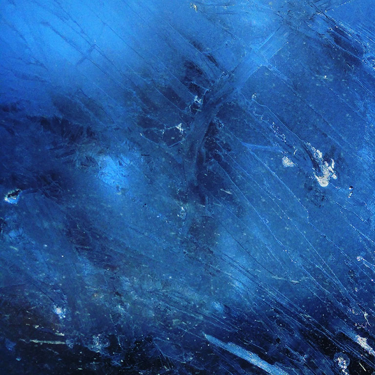 Abstract, textured blue background.