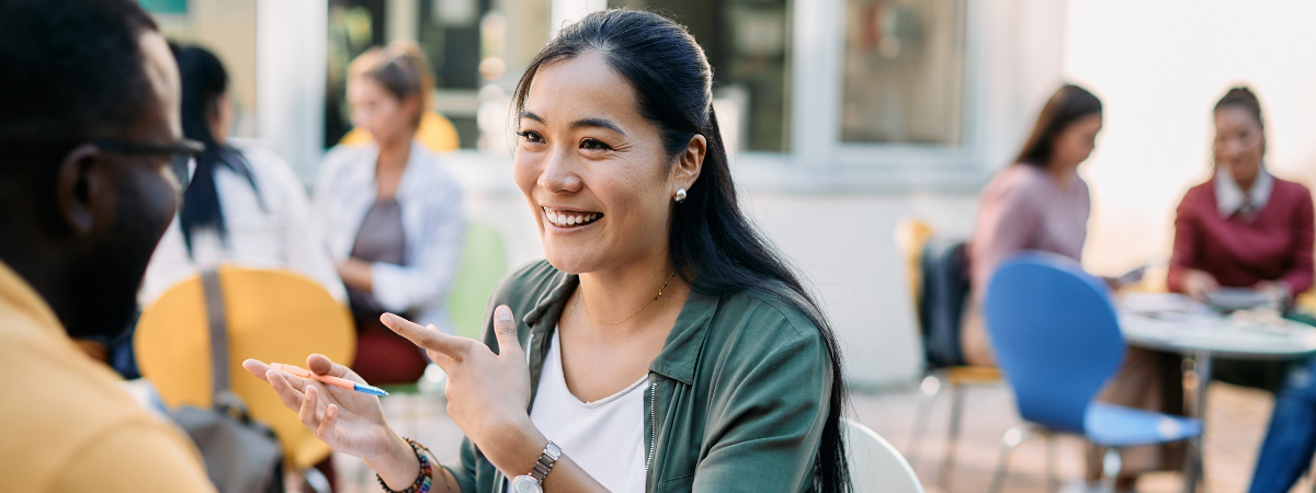 A person in an engaging conversation at an outdoor event.