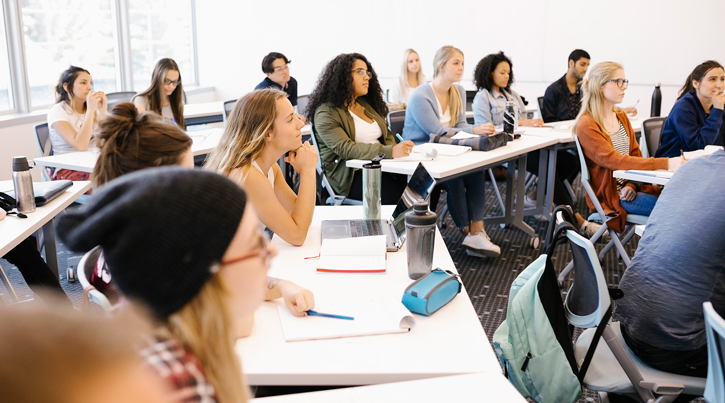 A group of students listening to a lecture in a Mount Royal classroom.