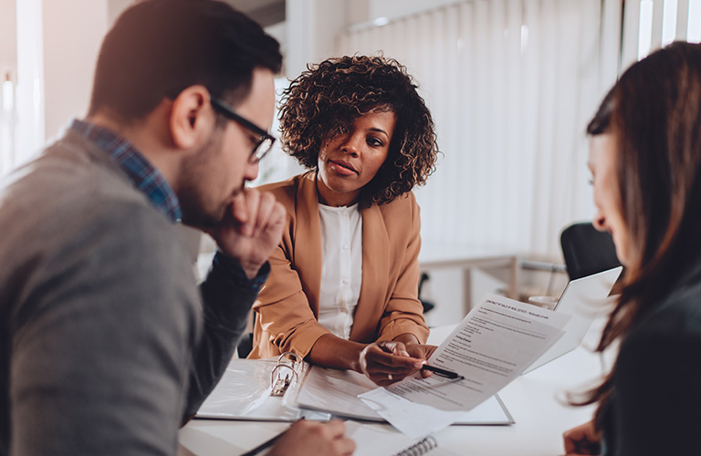 Two professionals discuss a business contract.