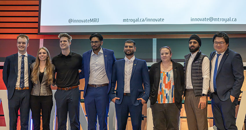 Winners of the KMH LaunchPad Pitch competition posing on stage at the event.