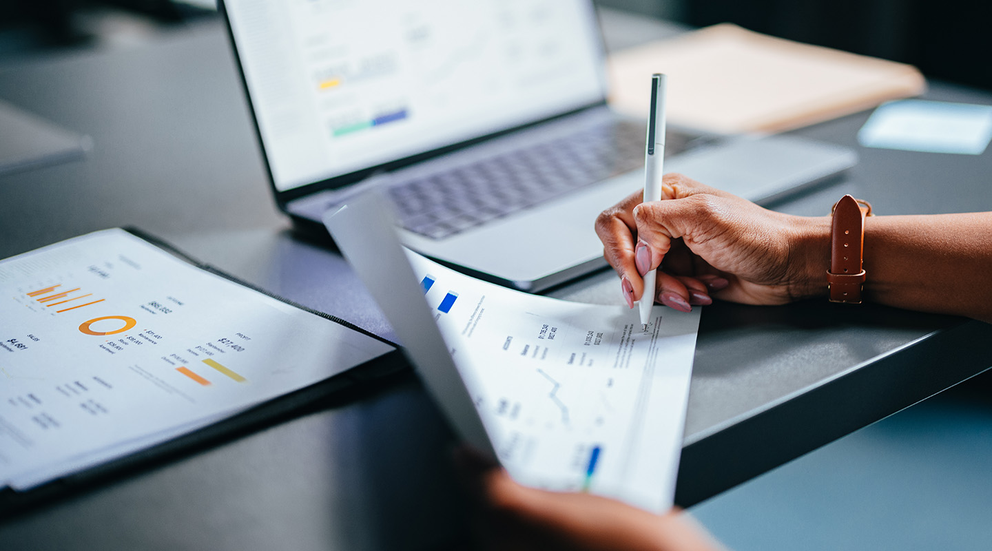 A professional reviewing financial documents.