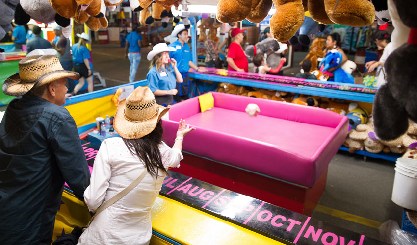 The Stampede grounds features various midway games. Photo courtesy Calgary Stampede.