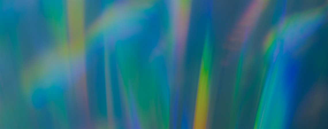 Teal background with streaks of multicoloured light.