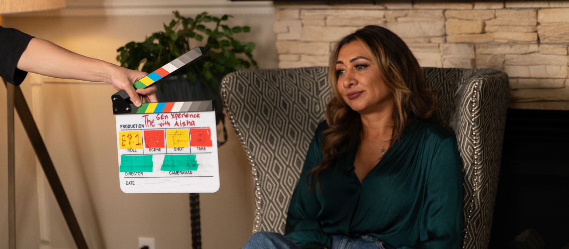 Aisha Sheikh seated on a couch, ready to start filming The Gen Xperience with Aisha